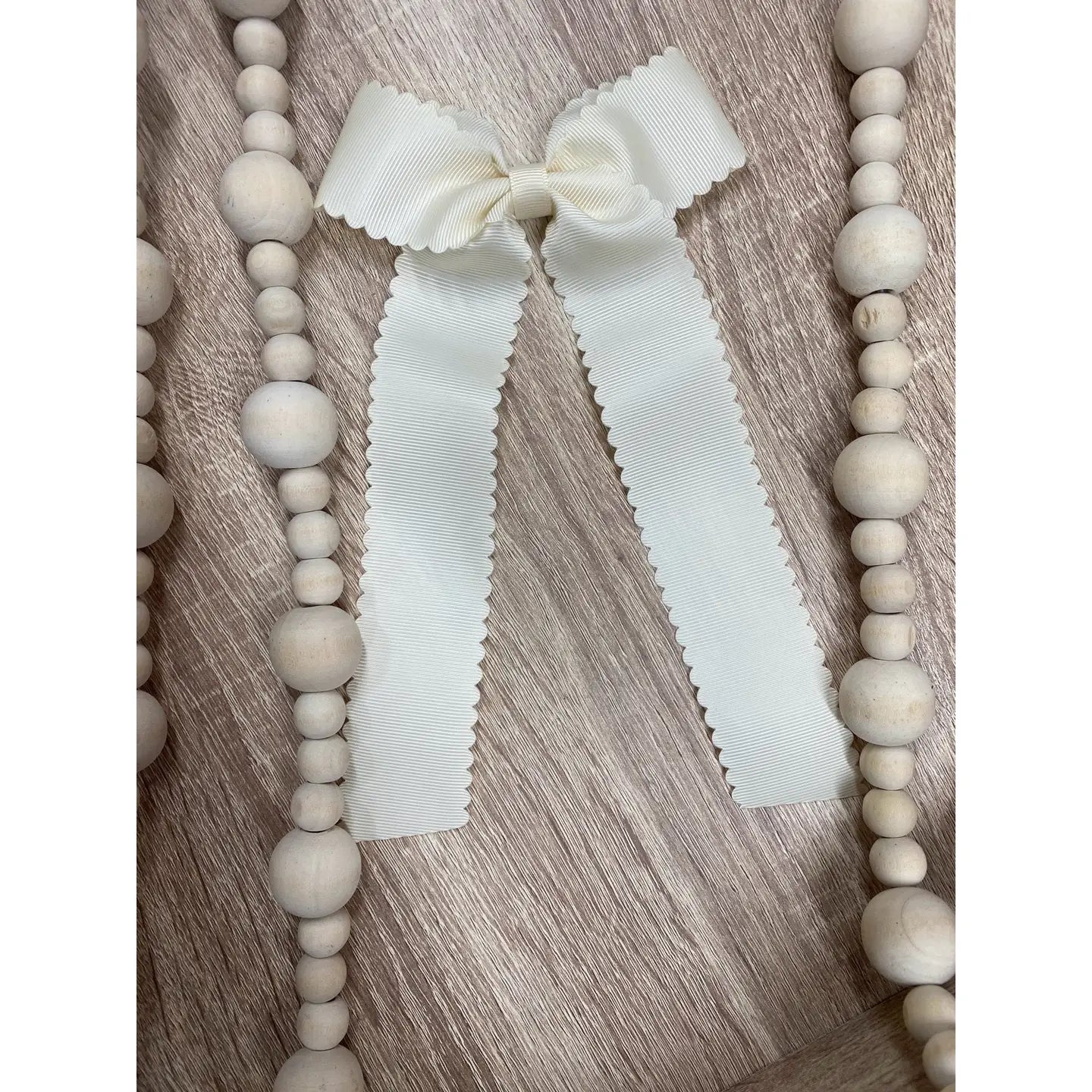Scalloped Long Tail Bow