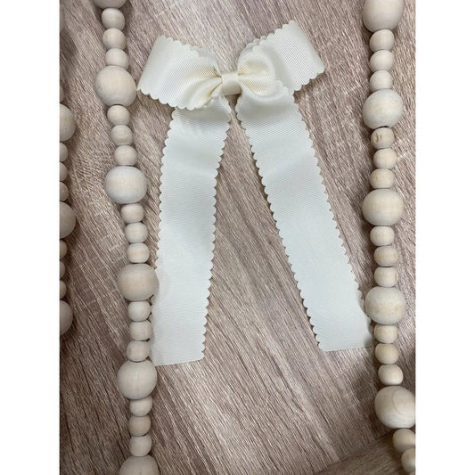 Scalloped Long Tail Bow